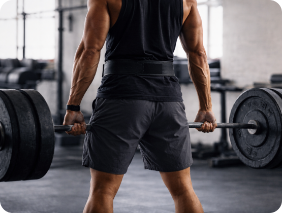 Man lifting weights at the gym, workout, and testosterone